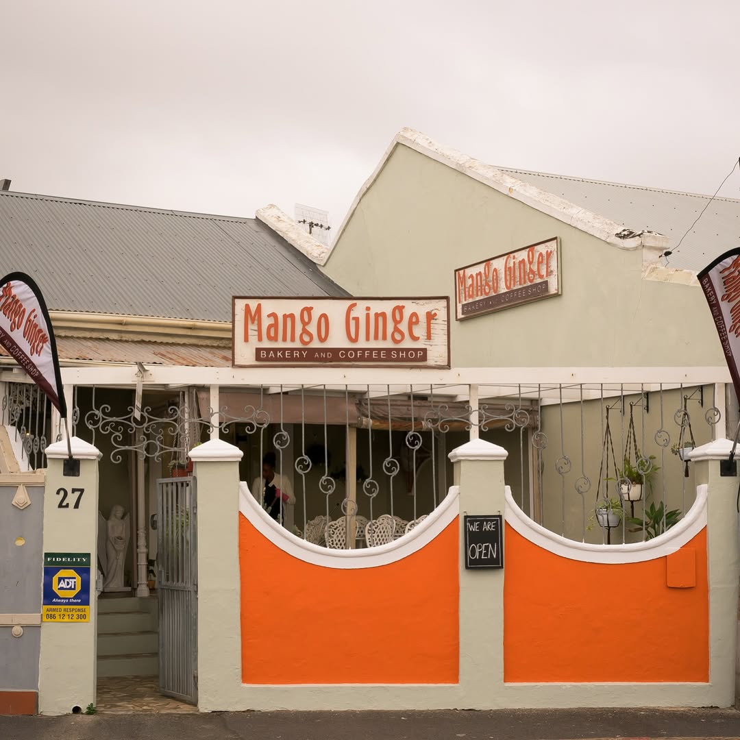 Mango Ginger Restaurant Exterior - Charming orange and white facade