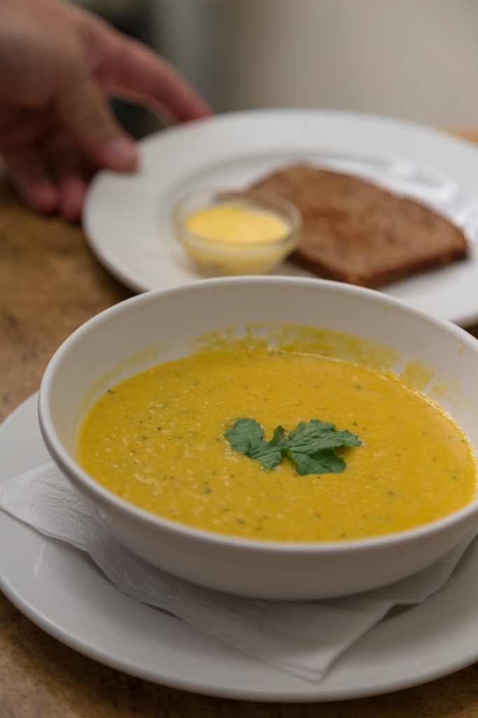 Homemade soup with fresh bread and butter